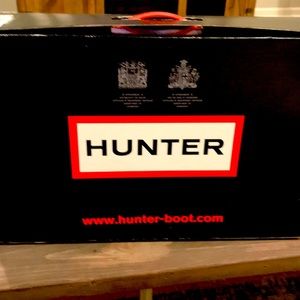 Hunter tall boots.